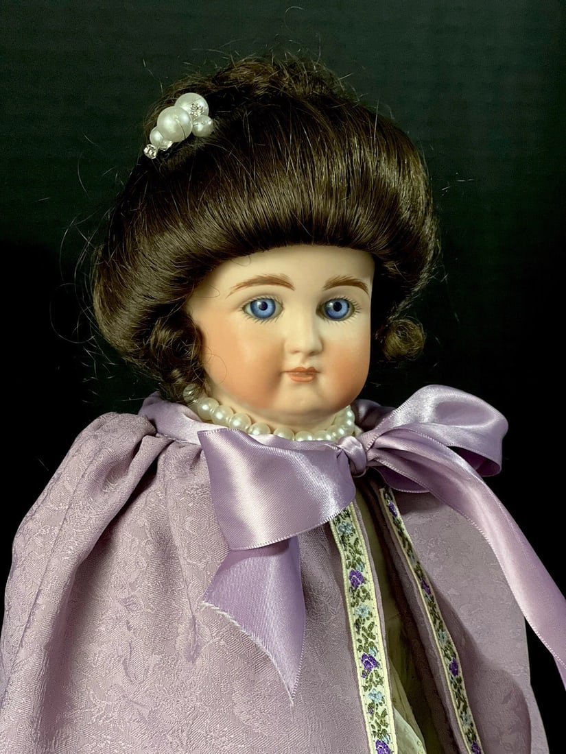 Vintage Reproduction of Kestner Alphabet Series Turned Head 21" Doll: Beautiful reproduction of Kestner Alphabet Series doll!!!She is approximately 21" tall.She has porcelain head and shoulder plate and partial arms. The rest of her body is stuffed cloth. Some stains ar