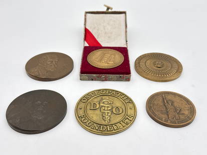 Vintage Commemorative Bronze & Brass Medallions – Medicine, Liberty, Freemasonry & More 197 white: A captivating lot of seven vintage and collectible medallions, each celebrating a unique moment, profession, or institution. Highlights include two finely detailed portrait medallions likely honoring