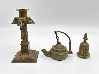 Vintage Brass Decor – Ornate Candlestick, Swing-Arm Teapot, and Decorative Flame Snuffer(000: This eclectic trio of vintage brass objects blends ceremonial charm with old-world design:Ornate Candlestick: Featuring raised lotus and floral motifs on a stepped base, this candlestick showcases Sou