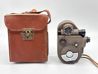 Vintage Revere Eight Model 88 8mm Film Camera with Leather Case (Untested) (003 orange): Classic Revere Eight Model 88 8mm movie camera with original brown leather case and wrist strap. Features exposure guide plate and fixed Cine Raptar lens. A handsome example of mid-century filmmaking
