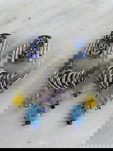 Zoé Coste - Pair of fancy ear clips Silver metal with a geometric design adorned with iridescen: Zoé Coste - Pair of fancy ear clips Silver metal with a geometric design adorned with iridescent buttons and multicolored glass bead pompoms (turquoise blue, pink, yellow, green). Zoé Coste