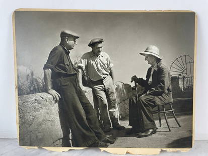Antique photograph - Rural conversation scene (circa 1950) Black and white silver print depicting: Antique photograph - Rural conversation scene (circa 1950) Black and white silver print depicting three men talking outdoors: two figures in work clothes standing, an older man seated with a cane and