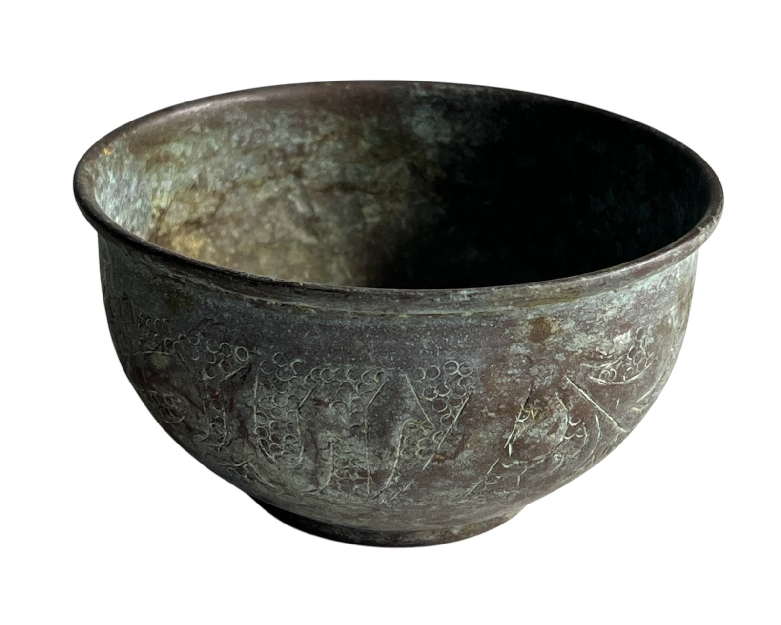 Ancient Bronze Ritual Bowl with Patina: This ancient bronze ritual bowl, with intricate etchings and a rich green-brown patina, possibly dating to the Bronze Age. Its weathered surface, featuring floral or symbolic patterns, suggests use in