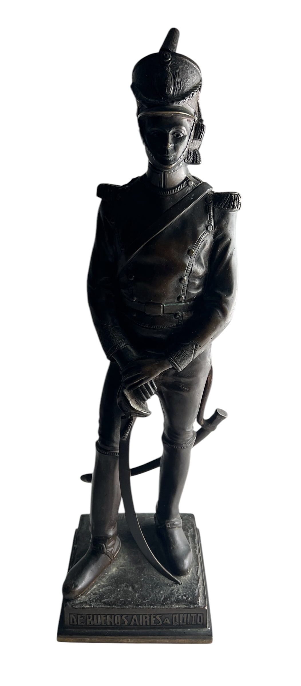 19th Century Bronze Figure of a South American Military Officer: This detailed bronze sculpture depicts a uniformed officer, likely from the period of South American independence movements, standing with a saber, the base inscribed "DE BUENOS AIRES A QUITO," sugges