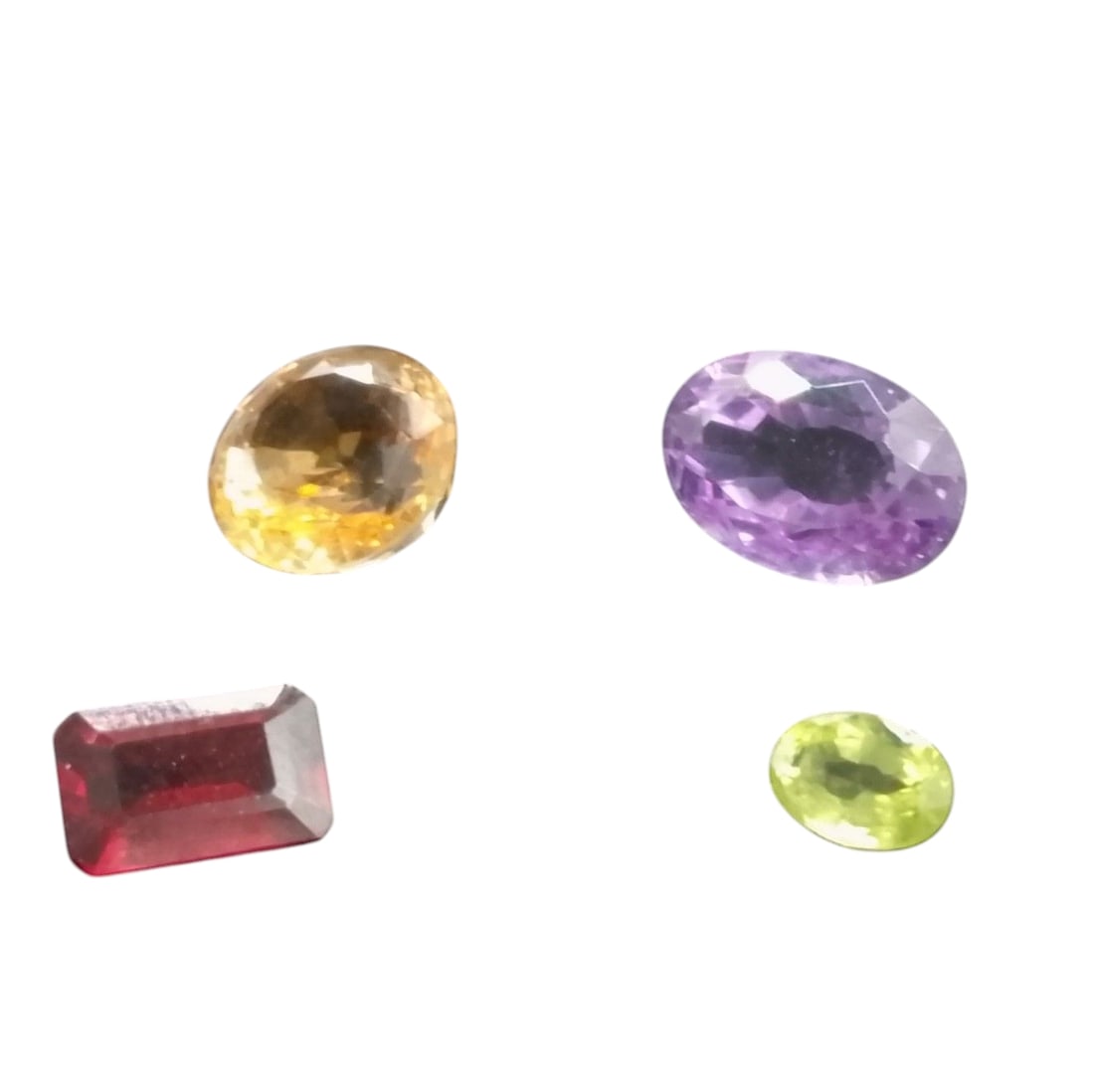 Multi Pack Loose Gemstones: Multi Pack Loose Gemstones - Amethyst, Citrine, and two other Gemstones. Other than Green; very large, coin and Garnet for comparison