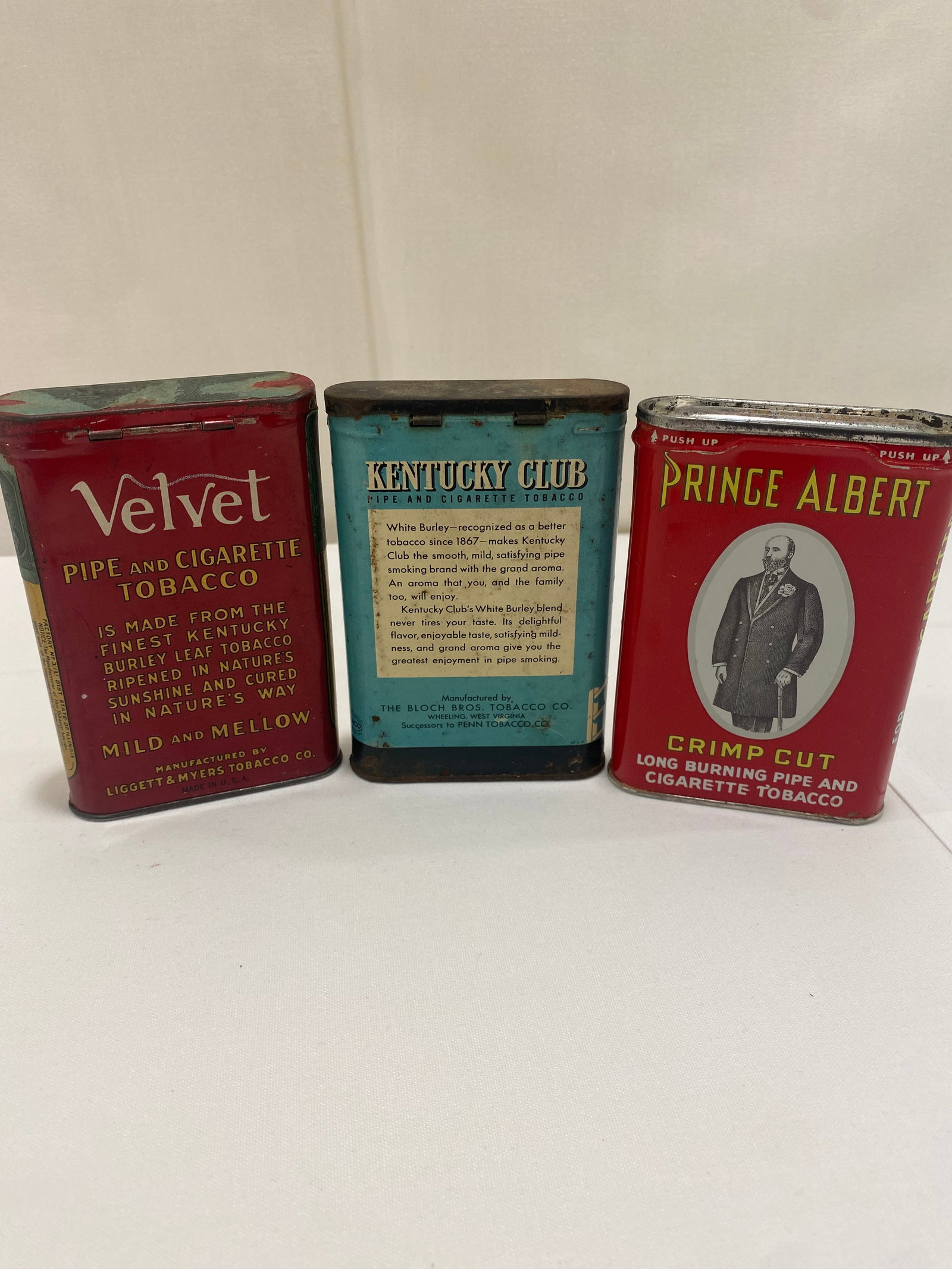 Tobacco Tins: 3 small tobacco tins, "Prince Albert, Kentucky Club, Velvet" 4-1/2 "t x 3"w x 1"d