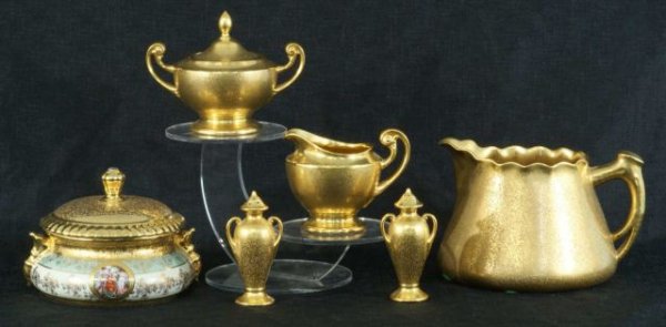 MIXED LOT OF SIX GOLD LIMOGES PIECES: MIXED LOT OF SIX GOLD LIMOGES PIECES. Large pitcher (6 x 9 x7), Lidded Dish (6 x 6), Salt and Pepper Shakers, Cream and Sugar.