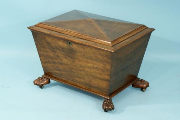 ANTIQUE ENGLISH REGENCY CELLARETTE, ca. 1810: ANTIQUE MAHOGANY ENGLISH REGENCY CELLARETTE RAISED ON PAW FEET. LEAD LINED COMPARTMENTS. CIRCA 1810. Height: 20 in. by Width: 27 1/2 in. by Depth: 21 in.