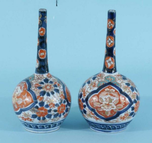 PAIR OF ANTIQUE IMARI BOTTLE NECK VASES: PAIR OF ANTIQUE IMARI BOTTLE NECK VASES. Height: 9 1/2 in. by Width: 5 in. by Depth: 5 in.