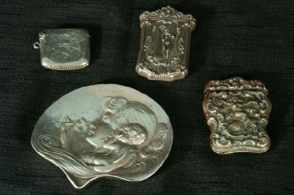 FOUR ART NOUVEAU STERLING SILVER PIECES: LOT OF FOUR ART NOUVEAU STERLING SILVER PIECES. PAPERWEIGHT, THREE MATCH SAFES. Height: 3 1/2 and 2 3/4 in. by Width: 4 and 2 in. by Depth: 1/2 and 1/2 in.