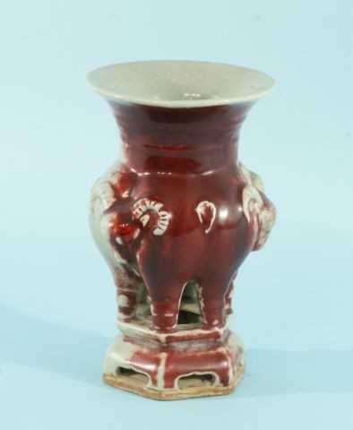 CHINESE PORCELAIN SANG DE BOEUF CELEDON VASE: CHINESE PORCELAIN SANG DE BOEUF AND CELEDON VASE. Small chip on rim area. Height: 8 1/2 in. by Width: 5 1/2 in. by Depth: 5 1/2 in.