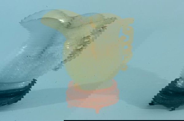 CHINESE CARVED JADE PITCHER WITH STAND: CHINESE CARVED JADE PITCHER WITH STAND. Height: 6 in. by Width: 6 in. by Depth: 2 1/2 in.