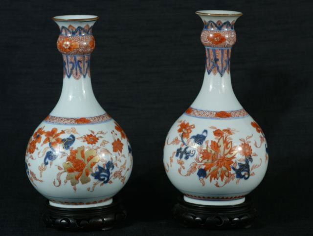PAIR OF CHINESE IMARI VASES, CIRCA 1880: A RARE PAIR OF ELEGANT BOTTLE FORM CHINESE IMARI VASES WITH FOLIATE LOTUS DESIGN. CIRCA 1880. (one repair to lip). Height: 11 and 10 in. by Width: 5 1/2 in. by Depth: 5 1/2 in.