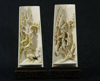 TWO CARVED IVORY GARDEN SCENES: TWO CARVED IVORY GARDEN SCENES WITH BIRDS PLACQUES WITH STANDS. Height: 8 in. by Width: 3 1/2 in. by Depth: 1 1/2 in.