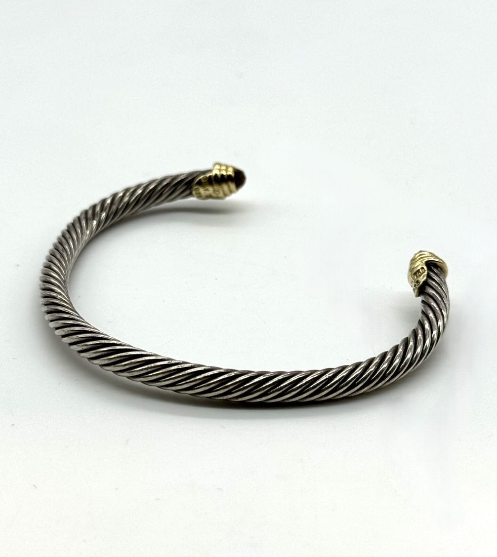 David Yurman Cable Classics Bracelet: David Yurman Cable Classics Bracelet Cable Classics Bracelet in Sterling Silver with 14K Yellow Gold DomesDavid Yurman’s artistic signature, Cable began as a bracelet that he hand-twisted from 50 fe