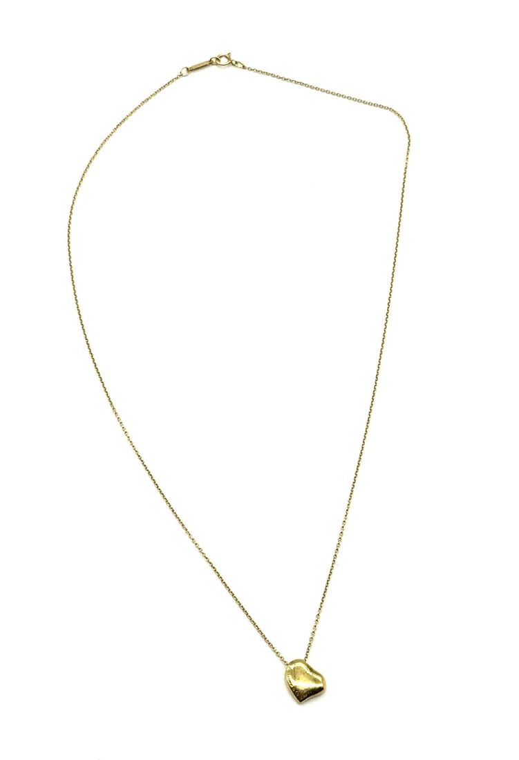 Tiffany & Co. x Elsa Peretti 18K Yellow Gold Fancy Puffed Heart Pendant Necklace: Tiffany & Co. x Elsa Peretti 18K Yellow Gold Fancy Puffed Heart Pendant Necklace This Tiffany Full Heart Necklace is crafted from 18K yellow gold, making it a versatile accessory suitable for business