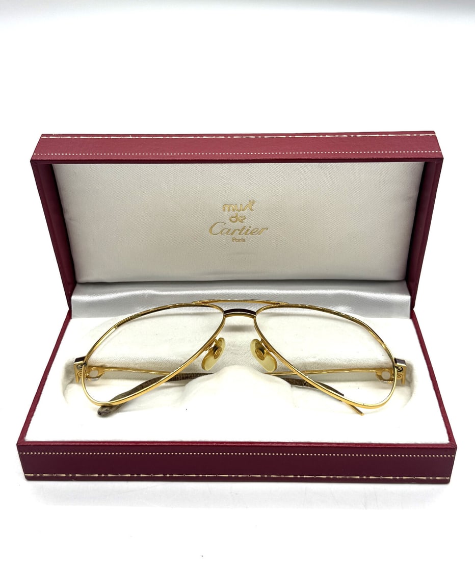Rare Vintage Santos Cartier Frame: Rare Vintage Santos Cartier FrameUp for sale is a stunning pair of vintage Must de Cartier Santos Paris Frame , featuring a classic gold-plated aviator-style frame. This iconic frame is a true collect