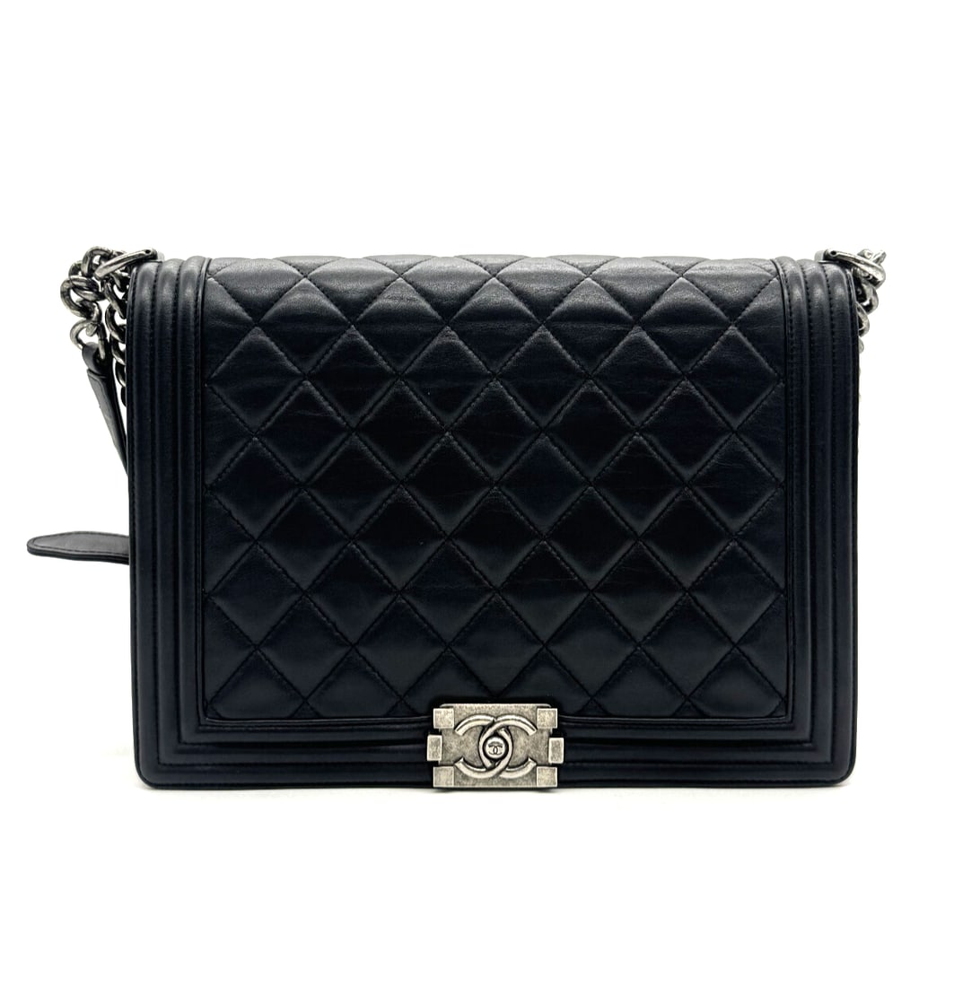 Chanel Calfskin Quilted Large Boy Flap Black: Chanel Calfskin Quilted Large Boy Flap BlackThis is an authentic CHANEL Calfskin Quilted Large Boy Flap in Black. This chic shoulder bag is crafted of diamond quilted luxurious calfskin leather with a