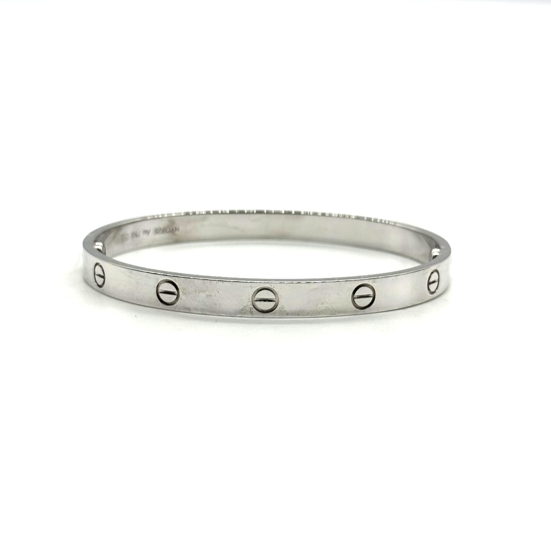Cartier Love Bracelet 18K White Gold Size 19: Cartier Love Bracelet 18K White Gold Size 19The Cartier Love Bracelet in 18K White Gold, size 19, is a luxurious and elegant piece of fine jewelry. Made by the prestigious brand Cartier, this bracelet