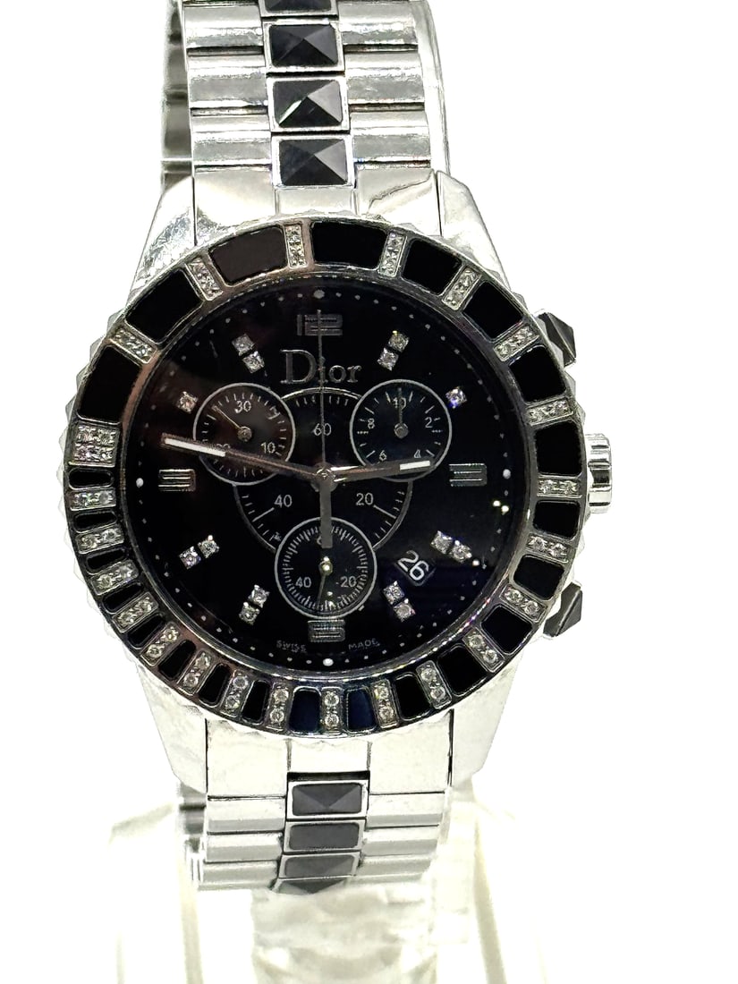 Christian Dior Stainless Steel Diamond Pave Bezel Sapphire 38mm Watch: his is an authentic CHRISTIAN DIOR Stainless Steel Ceramic Diamond 38mm Chronograph Christal Quartz Watch Black. The watch is crafted of stainless steel and black ceramic, and features a black dial wi