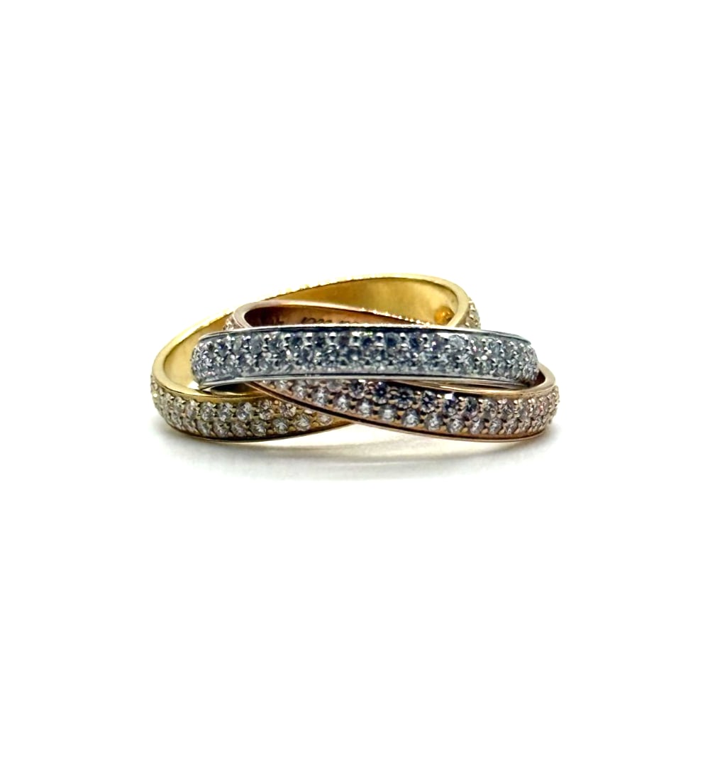 Cartier Trinity Diamond Band in 18K 3 Tone Gold: The Cartier Trinity Diamond Band in 18K 3 Tone Gold is a luxurious ring featuring a classic band style with a twist of three different gold tones. The ring is set with a sparkling white diamond as the
