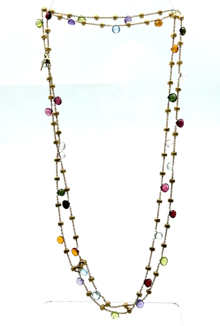 Marco Bicego large Africa Diamond Necklace: The Marco Bicego large Africa Diamond Necklace is a stunning piece of fine jewelry featuring a chain style design crafted from 18k yellow gold. The necklace showcases a variety of multicolor gemstones