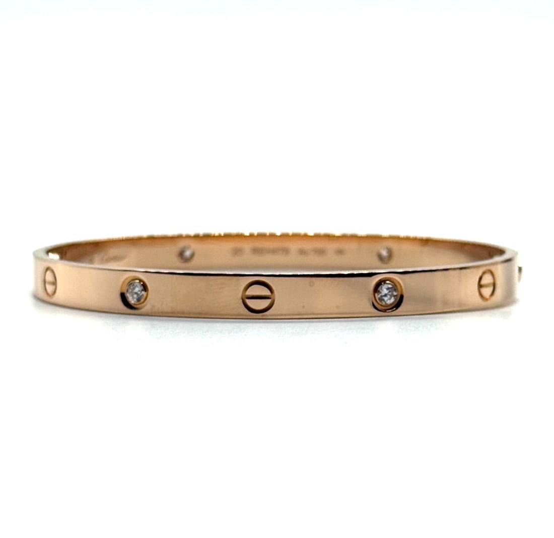 Cartier Love Bracelet 18Kt Rose Gold 4 Diamonds Size 20: The Cartier Love Bracelet in 18Kt Rose Gold with 4 Diamonds, Size 20, is a luxurious and elegant piece of fine jewelry. This bracelet features round-cut diamonds set in pink-colored rose gold, creatin
