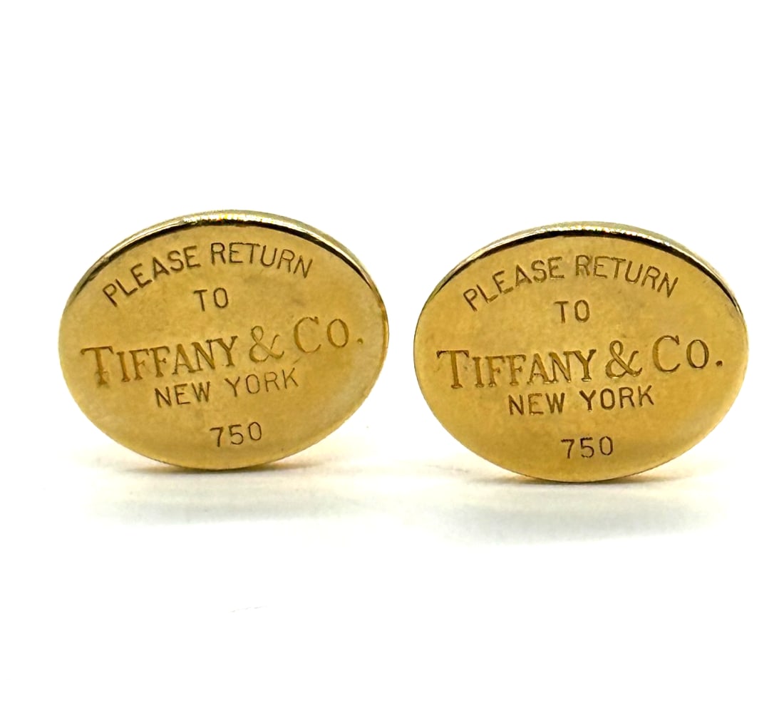 Tiffany & Co. Gold "Return to Tiffany" Cufflinks 18kt Yellow Gold: The Tiffany & Co. Gold "Return to Tiffany" Cufflinks are a luxurious accessory for men made from 18k yellow gold. With the iconic Tiffany & Co. branding, these cufflinks exude sophistication and style