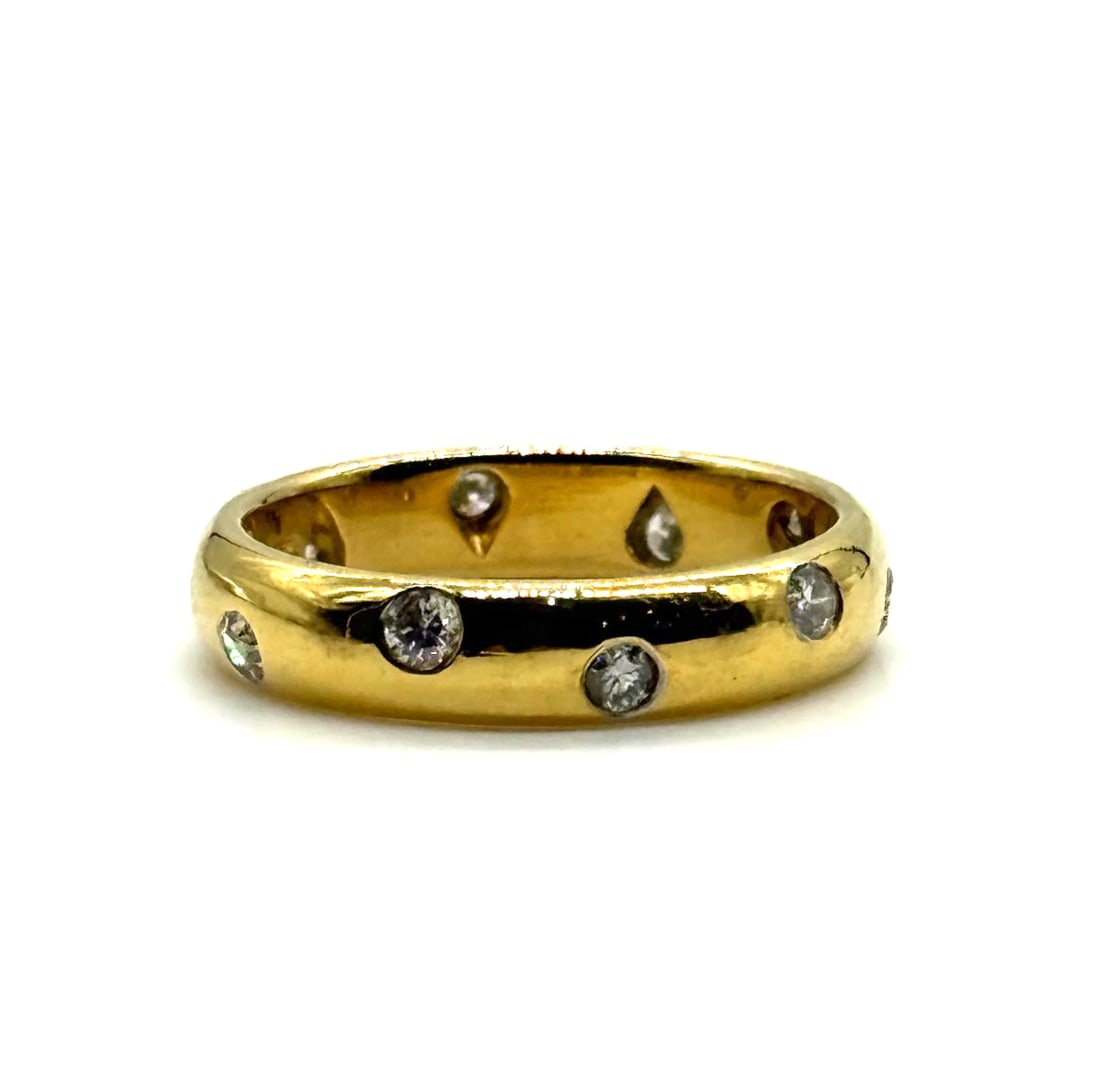 Vintage Tiffany & Co. 18K Yellow Gold Platinum Diamond 4mm Etoile Band Ring: The Vintage Tiffany & Co. 18K Yellow Gold Platinum Diamond 4mm Etoile Band Ring is a luxurious and elegant piece of fine jewelry. This ring features a stunning yellow diamond set in platinum, with a 1