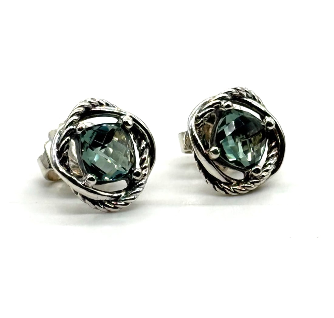 David Yurman Sterling Silver Prasiolite 7mm Infinity Earrings: The David Yurman Sterling Silver Prasiolite 7mm Infinity Earrings feature a stylish design with a unique infinity shape, showcasing a beautiful green prasiolite stone as the main focal point. These st