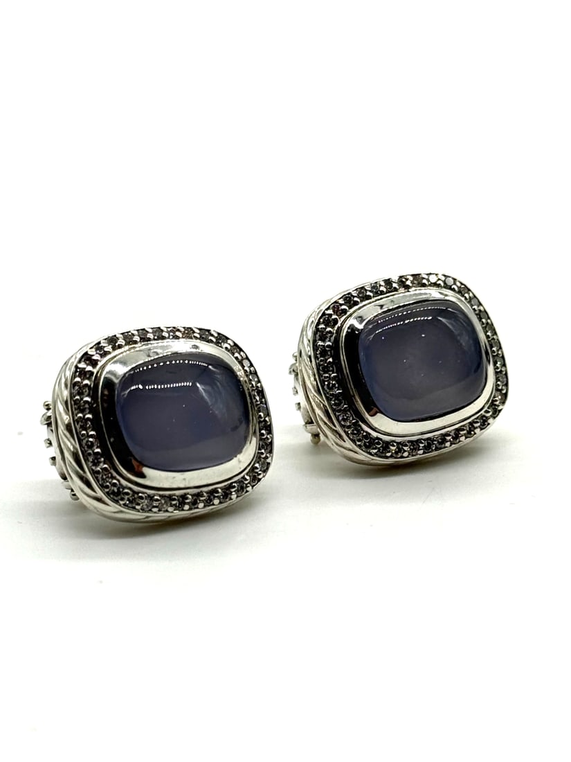 David Yurman Sterling Silver 14MM Chalcedony & Diamond Earrings: The David Yurman Sterling Silver 14MM Chalcedony & Diamond Earrings are a luxurious piece of fine jewelry. Made with 925 sterling silver, these earrings feature blue chalcedony stones set in the metal