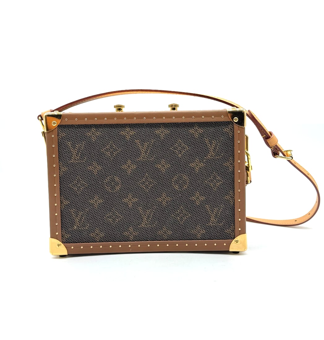 Limited Edition: Louis Vuitton Monogram Speaker Trunk PM: The Limited Edition Louis Vuitton Monogram Speaker Trunk PM is a luxurious shoulder bag designed for unisex adults. Made with a combination of canvas and leather in the iconic brown exterior color, th