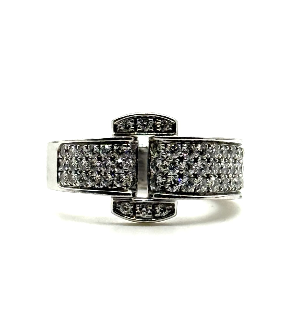 Piaget Miss Protocol 18 Kt White Gold Diamond Ring: The Piaget Miss Protocol 18 Kt White Gold Diamond Ring is a stunning piece of fine jewelry featuring a sleek and elegant design. Crafted from 18k white gold with a beautiful diamond as the main stone,