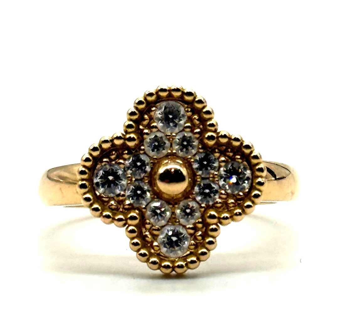 Van Cleef & Arpels Vintage Alhambra 18Kt Rose Gold And Diamond Ring: The Van Cleef & Arpels Vintage Alhambra 18Kt Rose Gold And Diamond Ring is a stunning piece of fine jewelry featuring a clover design with 12 round white/colorless diamonds set in pavé style on 18Kt