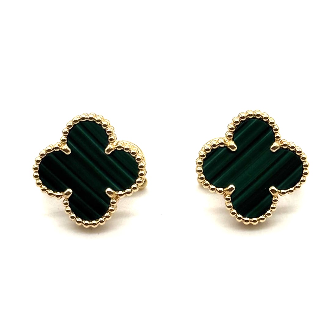 Van Cleef & Arpels Vintage Alhambra Motif Earrings Malachite 18K Yellow Gold: The Van Cleef & Arpels Vintage Alhambra Motif Earrings in Malachite and 18K Yellow Gold are a luxurious and stylish pair of earrings. With a huggie style design, these earrings showcase a beautiful Ma