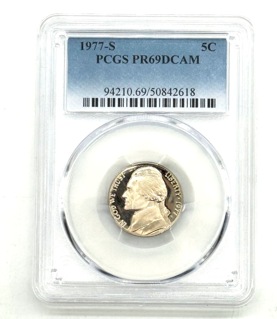 1977-S Jefferson Nickel - Proof, PR69 Deep Cameo (DCAM), graded by PCGS.: The 1977-S Jefferson Nickel in PR69 Deep Cameo (DCAM) grade, certified by PCGS, is a highly sought after coin among collectors. This uncirculated coin features the iconic image of Thomas Jefferson on