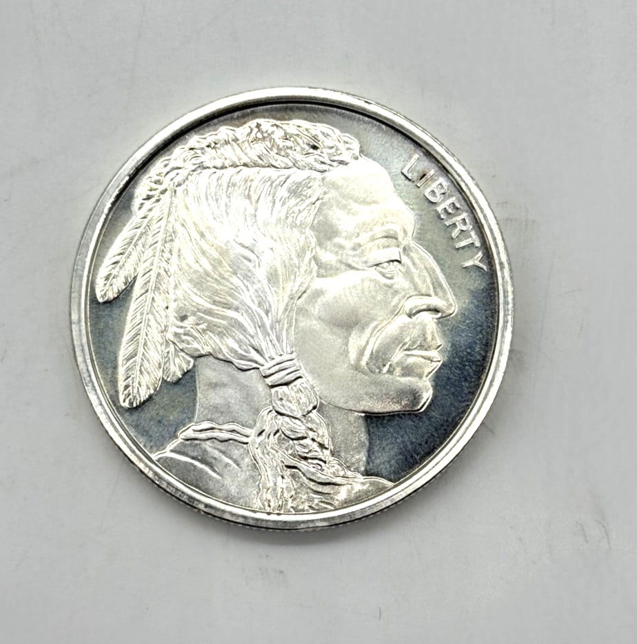 1 oz .999 Fine Silver Buffalo Round American Indian Head Design: The product is a 1 oz .999 fine silver Buffalo round, featuring an American Indian head design. This bullion round is made of pure silver with a fineness of 0.999. The round weighs 1 oz and is a valua