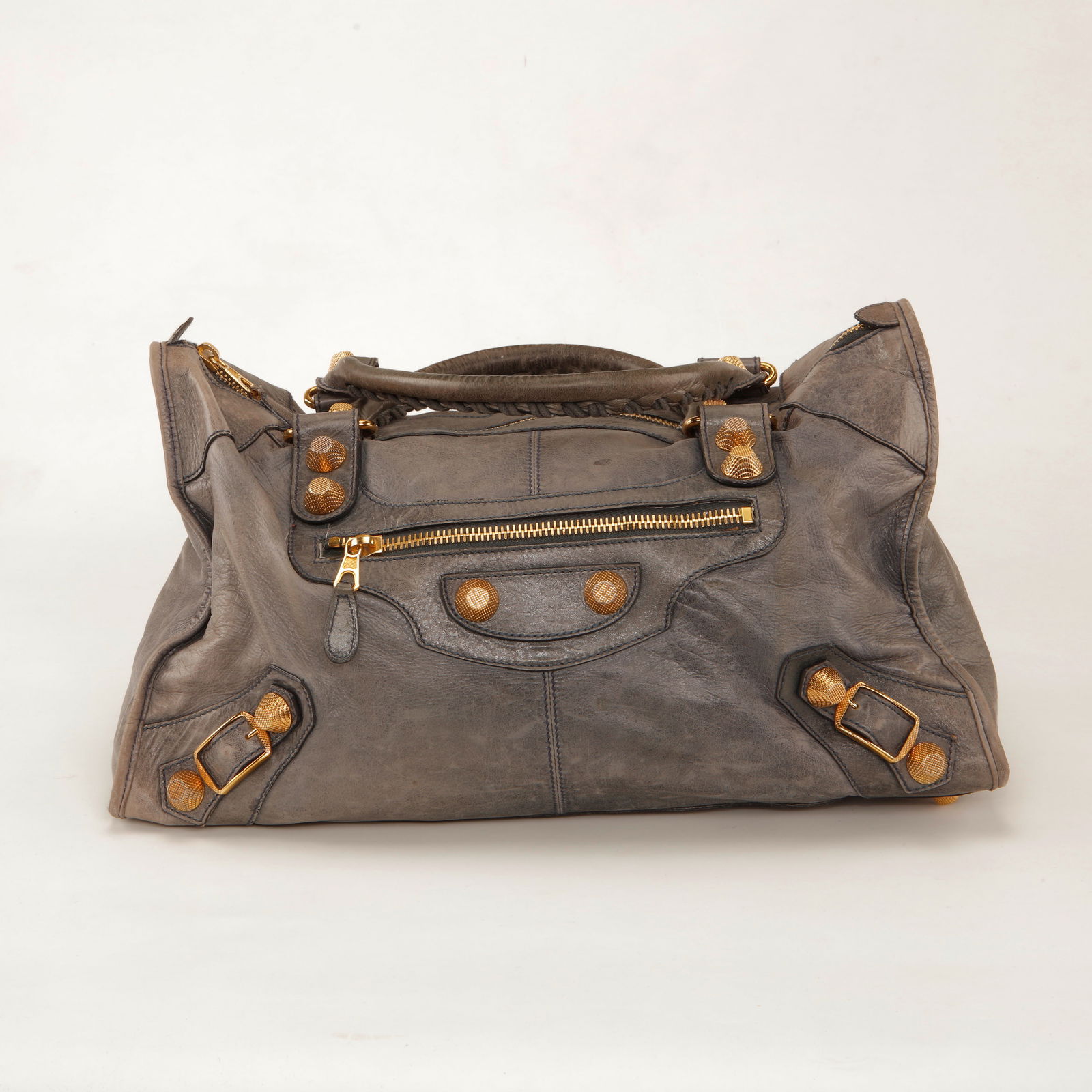 Rare Vintage Balenciaga Gray Leather City Bag with Gold Hardware: Rare Vintage Balenciaga City handbag crafted in distressed gray leather featuring signature gold-tone hardware, front zip pocket, stud detailing, and buckle accents. Designed with rolled leather handl