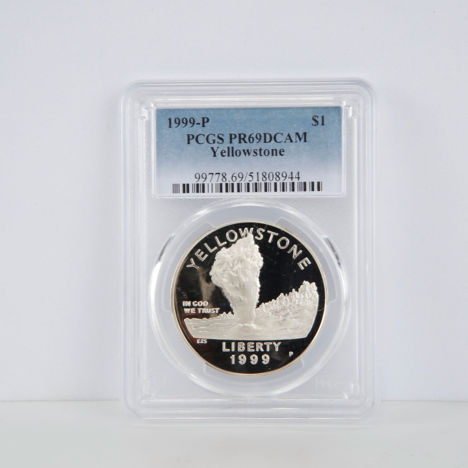 1999-P $1 Yellowstone Commemorative Silver Dollar – PCGS PR69DCAM: Offered here is a 1999-P Yellowstone Commemorative Silver Dollar graded PR69DCAM by PCGS, indicating a near-perfect Proof strike with exceptional Deep Cameo contrast between the mirrored fields and fr