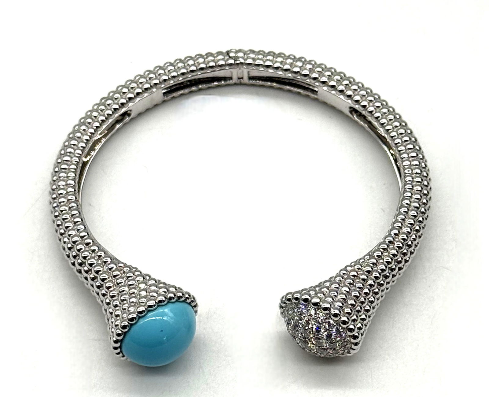 Van Cleef & Arpels Perlée Couleurs Turquoise & Diamond Open Cuff Bracelet 18K White Gold: Authentic Van Cleef & Arpels Perlée Couleurs open cuff bracelet crafted in 18K white gold. The bracelet features the Maison’s iconic Perlée beaded design, accented with a polished turquoise caboch