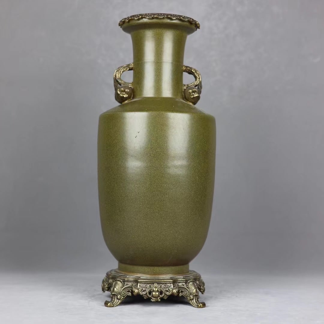 A Qing Dynasty tea glaze inlaid with copper pomegranate amphora mallet bottle: Qing Dynasty tea glaze inlaid copper pomegranate amphora mallet bottle Size: H:48.5cm Mouth D:14cm D:20cm Bottom:17.5cm (The Dimensions Of All Batches Are Manually Measured.If You Need More Detailed I