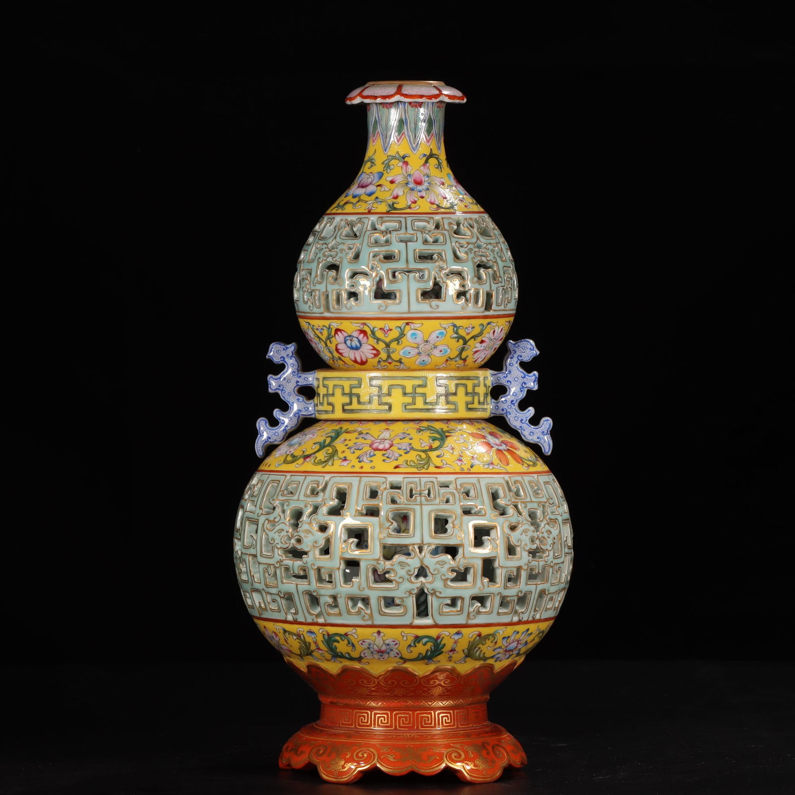 A yellow background pastel bean celadon glazed gilded entwined lotus floral pattern carved hollow: The Qianlong period of the Qing Dynasty made in the Qianlong period of the Yellow Background Pastel bean celadon glaze gilded entwined lotus floral pattern carved hollow dragon pattern amphora turning