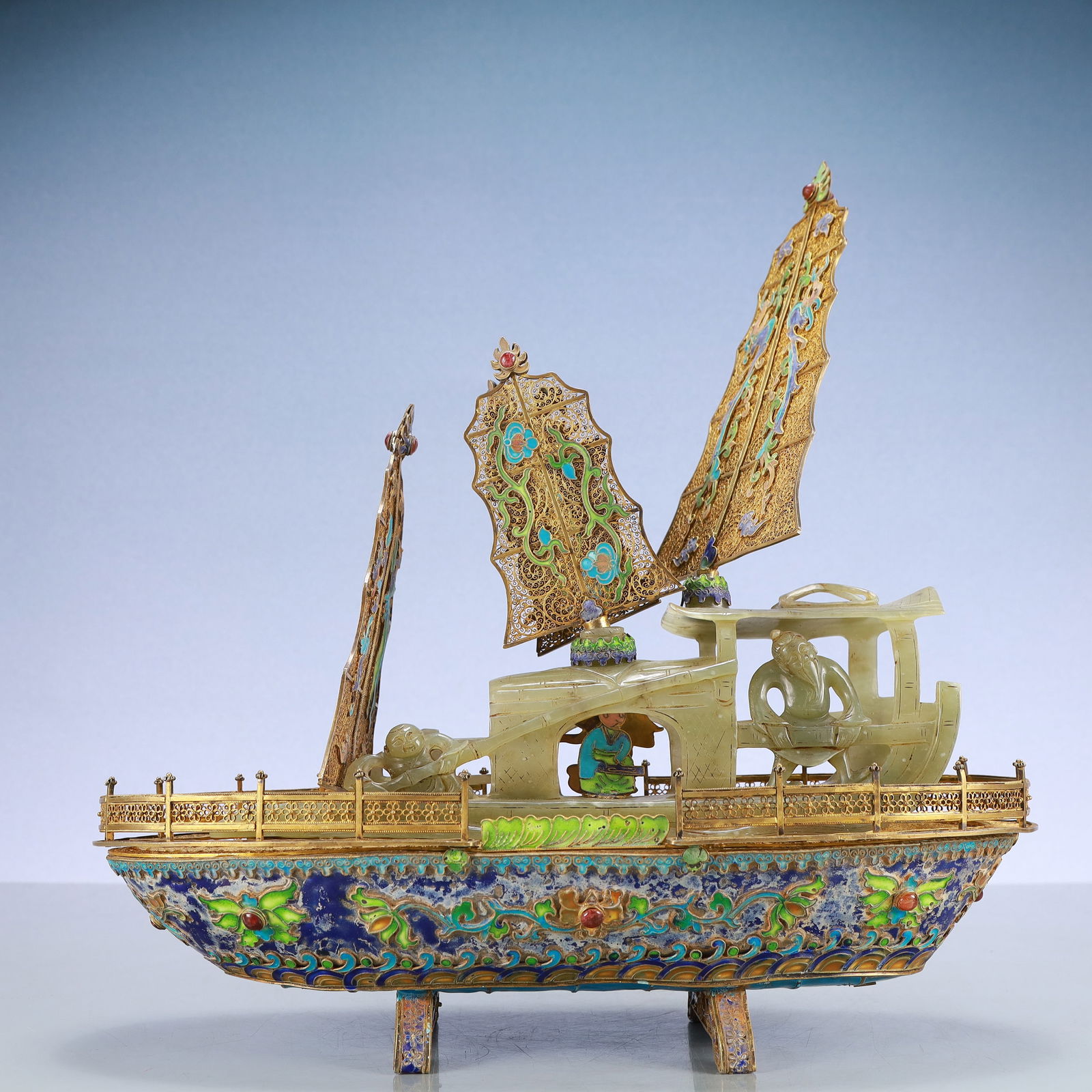 A Exquisite Gilt Bronze Inlaid Gems Lotus Pattern Boat Ornament: A Exquisite Gilt Bronze Inlaid Gems Lotus Pattern Boat Ornament Qing Dynasty, China Size:13inx5.5inx13.8in Weight:2000g铜鎏金嵌百宝缠枝莲纹&