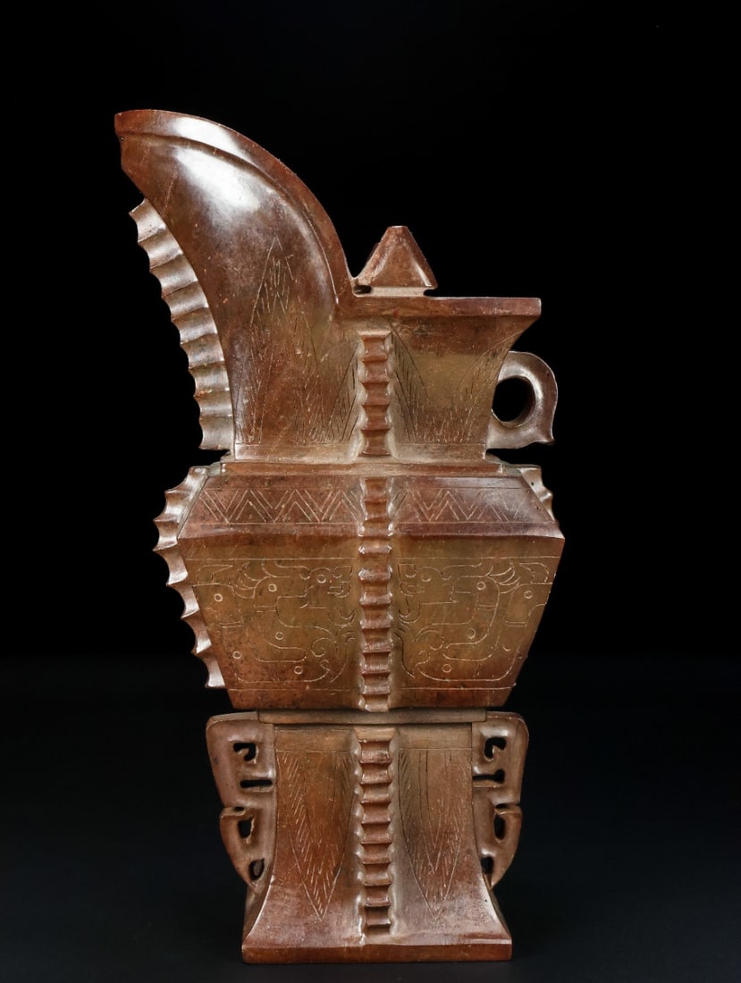 An Exquisite White Jade Dragon Pattern Goblet: An Exquisite White Jade Dragon Pattern Goblet Han Dynasty, China Size:22.5cmx13.3cmx8.4cm Weight:1.451kg (The Dimensions Of All Batches Are Manually Measured.If You Need More Detailed Information, Ple