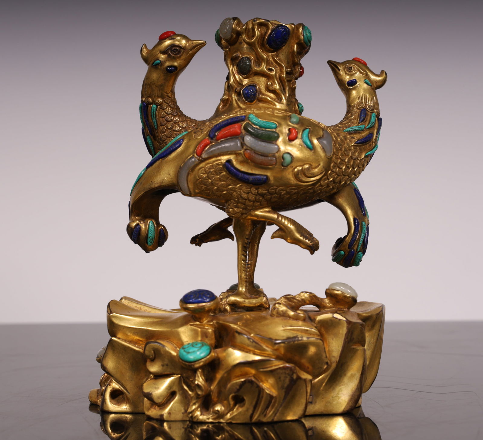 A Qing Dynasty copper-gilt phoenix bird candlestick: Qing Dynasty copper gilt phoenix bird candlestick SIZE: L:15.5cm W:11cm H:18.5cm W:2.8kg (The Dimensions Of All Batches Are Manually Measured.If You Need More Detailed Information, Please Contact Our