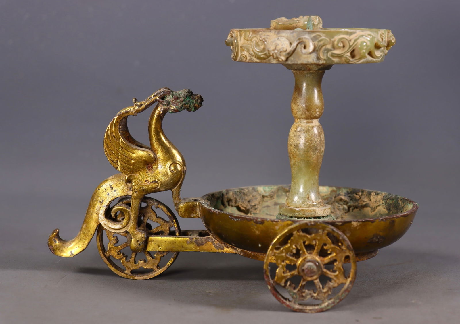 An Exquisite Gilt Bronze Inlaid White Jade Phoenix-Shaped Candlestick: An Exquisite Gilt Bronze Inlaid White Jade Phoenix-Shaped Candlestick Han Dynasty, China Size:15cmx20cmx13.5cm Weight:945g (The Dimensions Of All Batches Are Manually Measured.If You Need More Detaile