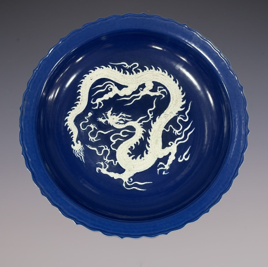 An Exquisite Ji Blue Glazed Dragon Pattern Plate: An Exquisite Ji Blue Glazed Dragon Pattern Plate Yuan Dynasty, China Size:7.5cmx44.5cm (The Dimensions Of All Batches Are Manually Measured.If You Need More Detailed Information, Please Contact Our Cu