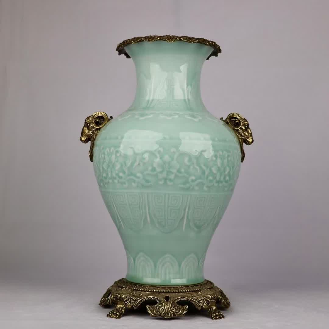 A celadon glazed bronze sheep's head amphorae high appreciation vase: The blue glaze is inlaid with copper sheep's head, and the amphorae are high enough to appreciate the vase SIZE: H: 38cm MouthD: 15cm D: 24cm Bottom diameter: 18cm (The Dimensions Of All Batches Are M