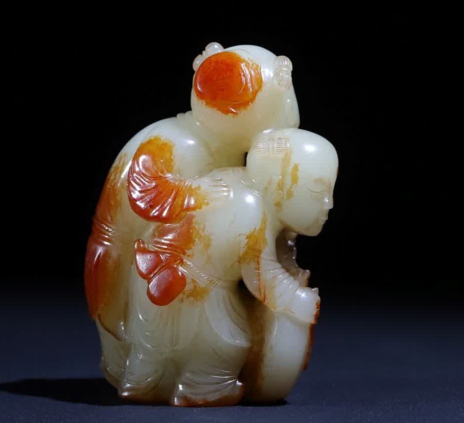 A Qing Dynasty jade carving red leather double children's drum furnisher: Qing Dynasty jade carving red skin double children's drum display vessel SIZE: H:8.7cm L:5.1cm W:5.1cm (The Dimensions Of All Batches Are Manually Measured.If You Need More Detailed Information, Pleas