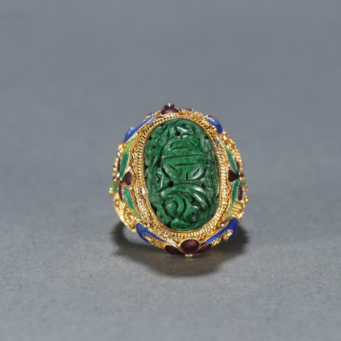 A Qing Dynasty silver-gilt filigree inlaid jade ring (1 of 8)